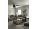 Comfortable living room with modern ceiling fan, neutral colors and furnishings at 3019 Visionary Dr., Myrtle Beach, SC 29588