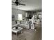 Open-concept living room with neutral tones, comfortable seating, and seamless kitchen access at 3019 Visionary Dr., Myrtle Beach, SC 29588