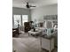Comfortable living room boasts natural light, ceiling fan, stylish decor, and cozy seating arrangement at 3019 Visionary Dr., Myrtle Beach, SC 29588