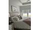 Bright main bedroom offers a serene retreat with a plush bed and peaceful water views at 3019 Visionary Dr., Myrtle Beach, SC 29588
