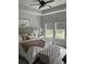 Spacious main bedroom provides a tranquil setting with views and an inviting seating area at 3019 Visionary Dr., Myrtle Beach, SC 29588