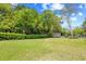 Large grass backyard, trimmed hedges, storage shed and golf cart parking at 311 71St Ave. N # 3-D, Myrtle Beach, SC 29572