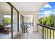 Outdoor balcony area with a view and chairs and table at 311 71St Ave. N # 3-D, Myrtle Beach, SC 29572