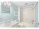 Clean bathroom with a tub/shower combination, vanity, and nautical themed art at 311 71St Ave. N # 3-D, Myrtle Beach, SC 29572