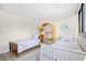 Bright bedroom featuring two twin beds with beachy decor and a window at 311 71St Ave. N # 3-D, Myrtle Beach, SC 29572
