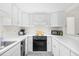 Bright white kitchen features modern appliances and fixtures at 311 71St Ave. N # 3-D, Myrtle Beach, SC 29572