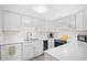 Bright white kitchen features modern appliances and fixtures at 311 71St Ave. N # 3-D, Myrtle Beach, SC 29572