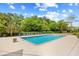 Community pool with lounge chairs, landscaping, and clear water at 311 71St Ave. N # 3-D, Myrtle Beach, SC 29572