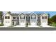 Charming townhomes showcase a modern design with attached garages and colorful front doors at 3208 Nw Edgemead Circle # B, Calabash, NC 28467