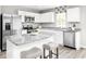 Modern kitchen with stainless steel appliances, granite counters, and an island with bar seating at 3208 Nw Edgemead Circle # B, Calabash, NC 28467