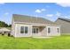 A home featuring a well-maintained lawn and covered patio area for relaxation and entertaining at 3332 Little Bay Dr., Conway, SC 29526