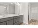 Bathroom featuring a double vanity, gray cabinets, and a walk-in shower at 3332 Little Bay Dr., Conway, SC 29526