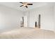 Large bedroom with a ceiling fan, plush carpet, and doorways that lead to other rooms in the house at 3332 Little Bay Dr., Conway, SC 29526