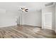 Spacious bedroom featuring hardwood floors, ceiling fan, and ample natural light at 3332 Little Bay Dr., Conway, SC 29526