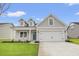 Charming single-Gathering home featuring a two-car garage, well-kept lawn and a welcoming entryway at 3332 Little Bay Dr., Conway, SC 29526