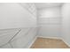 Spacious walk-in closet featuring wire shelving and neutral carpeting, offering ample storage space at 3332 Little Bay Dr., Conway, SC 29526