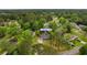 Aerial view of a home nestled among mature trees in a quiet residential neighborhood at 4 Catawba Ct., Myrtle Beach, SC 29588