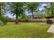 Spacious backyard featuring a lush green lawn and a wooden fence, providing privacy at 4 Catawba Ct., Myrtle Beach, SC 29588