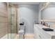 Modern bathroom featuring a glass-enclosed shower, single sink vanity with bronze fixtures, and neutral color palette at 4 Catawba Ct., Myrtle Beach, SC 29588
