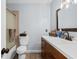 Bright bathroom featuring an updated vanity with dark wood cabinets, updated bronze fixtures, and tile flooring at 4 Catawba Ct., Myrtle Beach, SC 29588