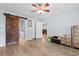 Primary bedroom showcasing a sliding barn door to bathroom, and ample closet space for efficient storage at 4 Catawba Ct., Myrtle Beach, SC 29588