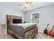 Comfortable bedroom featuring light colored walls, a ceiling fan, a window, and wood-look floors at 4 Catawba Ct., Myrtle Beach, SC 29588