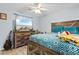 Cozy bedroom with a ceiling fan, light-colored walls, a large dresser and a TV at 4 Catawba Ct., Myrtle Beach, SC 29588