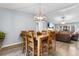 Bright dining room with a modern light fixture and views into the living space, ideal for entertaining guests at 4 Catawba Ct., Myrtle Beach, SC 29588