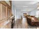 Open-concept living room with hardwood floors leading into a dining area, creating a seamless and inviting atmosphere at 4 Catawba Ct., Myrtle Beach, SC 29588