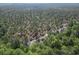 Expansive aerial view reveals a dense forest, offering privacy and a connection with nature at 4005 Sweetspire Court, Conway, SC 29526