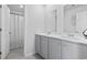 Bright bathroom featuring a double sink vanity with modern fixtures and a shower at 4005 Sweetspire Court, Conway, SC 29526