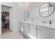 Bright bathroom featuring a double sink vanity with modern fixtures and a walk-in closet at 4005 Sweetspire Court, Conway, SC 29526