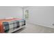 Bright bedroom with a cozy bed, blanket, and natural light from the window at 4005 Sweetspire Court, Conway, SC 29526