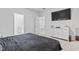 Comfortable bedroom with soft carpet, white dresser, and a glimpse into an adjacent bathroom, lots of light at 4005 Sweetspire Court, Conway, SC 29526