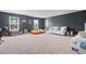 Spacious bonus room with neutral walls and carpet featuring multiple seating areas at 4005 Sweetspire Court, Conway, SC 29526