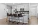 Modern kitchen with granite countertops, stainless steel appliances, and a stylish island with bar seating at 4005 Sweetspire Court, Conway, SC 29526