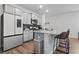 Stylish kitchen featuring gray cabinets, granite countertops, stainless steel appliances, and a bar-style island at 4005 Sweetspire Court, Conway, SC 29526