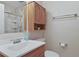 Well-lit bathroom featuring a spacious shower and a wood cabinet at 401 77Th Ave. N # 11, Myrtle Beach, SC 29572