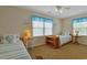 Charming bedroom featuring two twin beds, each with a seashell accent pillow and matching side tables at 401 77Th Ave. N # 11, Myrtle Beach, SC 29572