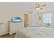 Bright bedroom with a queen bed, white dresser, and a comfortable sitting area at 401 77Th Ave. N # 11, Myrtle Beach, SC 29572