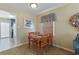 Cozy dining area featuring a wooden table set and access to the kitchen at 401 77Th Ave. N # 11, Myrtle Beach, SC 29572