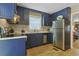 Well-equipped kitchen with stainless steel appliances, and dark cabinetry at 401 77Th Ave. N # 11, Myrtle Beach, SC 29572