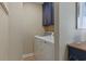 Efficient laundry room with navy blue cabinets, a modern washer, and a dryer at 401 77Th Ave. N # 11, Myrtle Beach, SC 29572