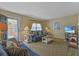 Bright and cozy living room with comfortable furniture, coastal decor, and easy access to the outdoors at 401 77Th Ave. N # 11, Myrtle Beach, SC 29572