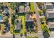 Aerial view showcasing the home's layout, including the driveway, yard, and surrounding neighborhood at 407 15Th Ave. S, North Myrtle Beach, SC 29582