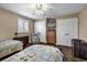 Bedroom with two beds, ceiling fan, TV, and closet creating a comfortable and functional living space at 407 15Th Ave. S, North Myrtle Beach, SC 29582