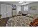 Bedroom with two beds, featuring a TV, dual closets, and a bright window, offering a functional and stylish layout at 407 15Th Ave. S, North Myrtle Beach, SC 29582