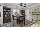 Cozy dining area with hardwood floors, neutral walls, crown molding and a dining table at 407 15Th Ave. S, North Myrtle Beach, SC 29582