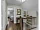 Bright hallway with hardwood floors leads to a bedroom, complemented by decor and built-in shelving for storage at 407 15Th Ave. S, North Myrtle Beach, SC 29582