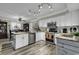 Modern kitchen with white cabinets, granite countertops, stainless steel appliances, and spacious layout at 407 15Th Ave. S, North Myrtle Beach, SC 29582
